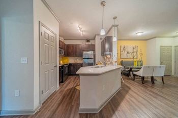 Designer kitchens with custom cabinetry, granite countertops and tile backsplash